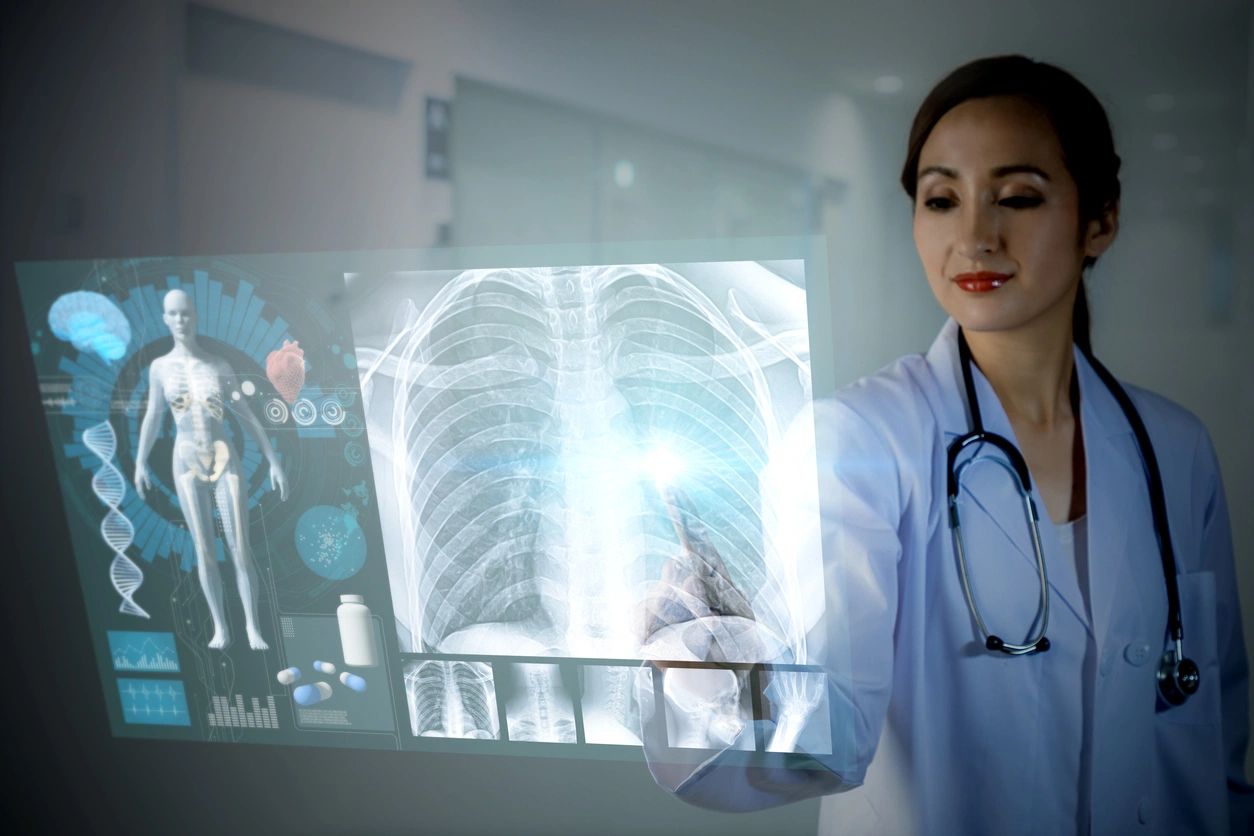 A female physician reviewing and touching a futuristic, interactive digital chest X-ray display screen.