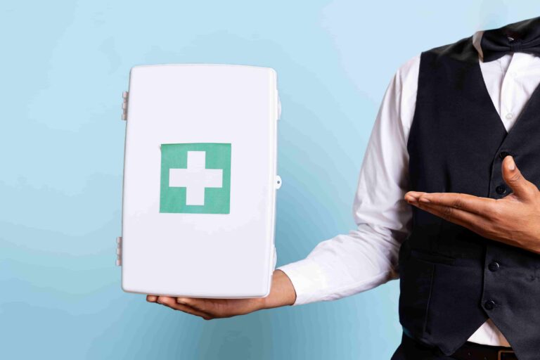 A butler holding a first aid kit, conceptually illustrating luxury concierge medicine care.