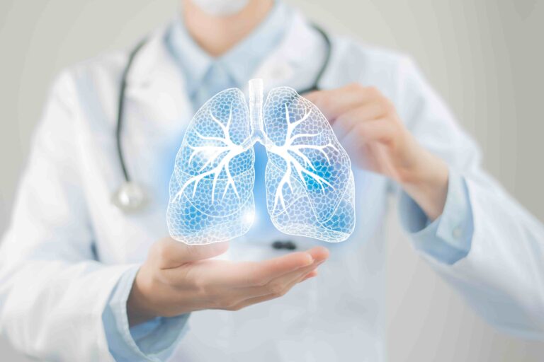 A pulmonologist in a lab coat holding a glowing, digital 3D hologram model of human lungs.